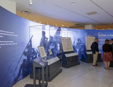 Documents and artifacts on display in the exhibit.