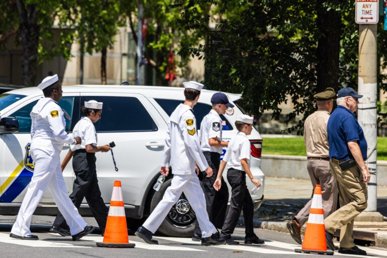 Members of America’s Sea Cadets carry water bottles on Independence Mall in Philadelphia on July 2, 2026.