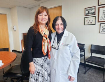 Huanmei Wu and Terry Heiman-Patterson pose for photo