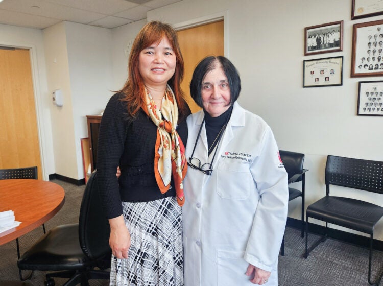 Huanmei Wu and Terry Heiman-Patterson pose for photo