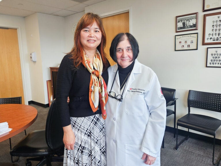 Huanmei Wu and Terry Heiman-Patterson pose for photo