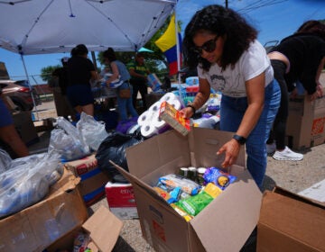 Volunteers sort supplies to send to Venezuelan earthquake victims