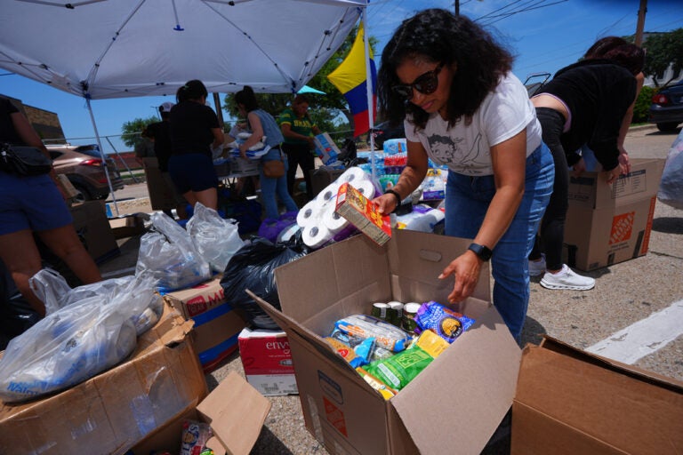 Volunteers sort supplies to send to Venezuelan earthquake victims