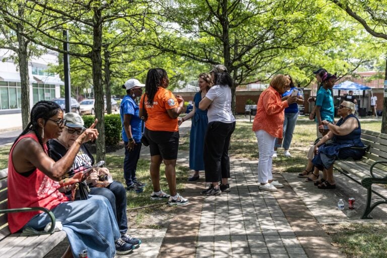 Community members gather at the park outside the WIllingboro Library