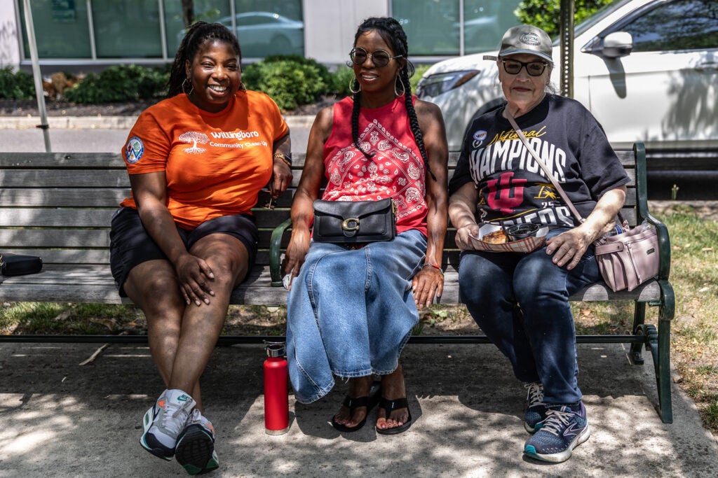 Mayor of Willingboro Samantha Whitfield (in orange) chats with Gail Fountaine