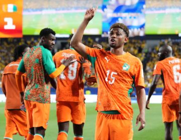 Ivory Coast's Amad Diallo (15) gestures to fans