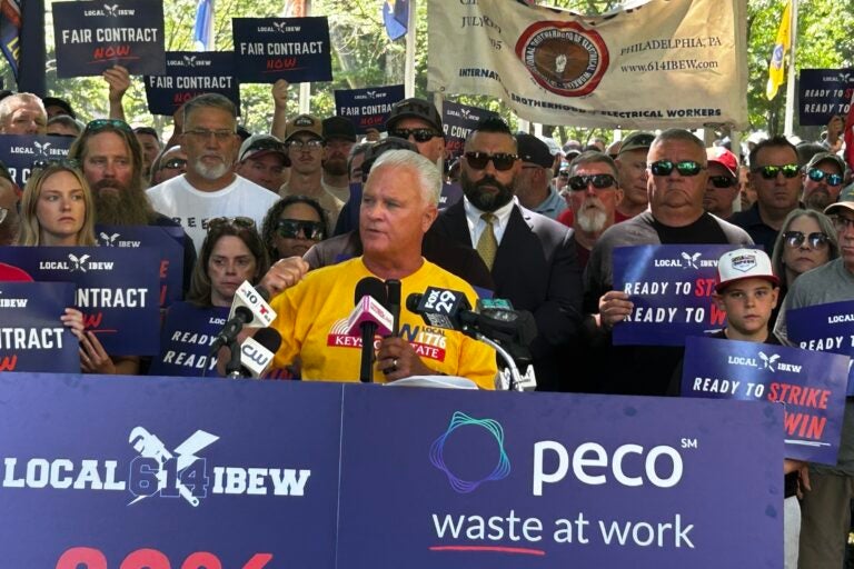 Wendell Young speaking at a podium in Washington Square Park on June 25, 2025