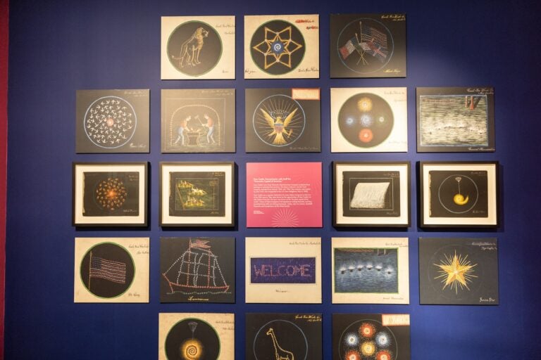Paintings advertising products made by the Conti Fireworks Manufacturing Company