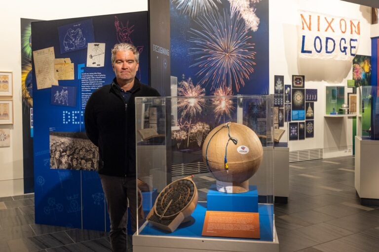 Jesse Smith, Science History Institute director, stands in the fireworks exhibit in the museum. (Kimberly Paynter/WHYY)