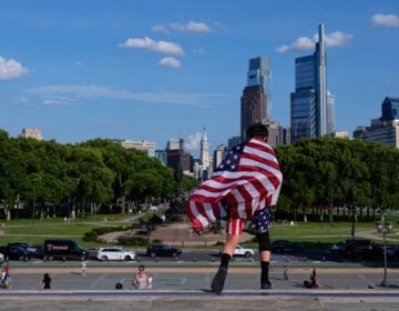 A young fan with US flag walks down the Rocky Steps during the the 2026 FIFA World Cup in Philadelphia, Friday, June 12, 2026. (AP Photo/Petr David Josek)