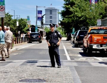 2026-06-09-e-lee-philadelphia-market-and-2nd-traffic-police-file A Philadelphia police officer directs traffic at 2nd and Market streets.