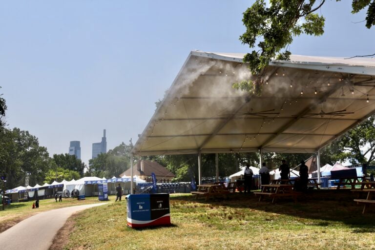A fine mist falls from the ceiling of a tent at FIFA Fan Fest at Lemon Hill