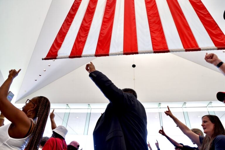 Mayor Cherelle Parker urges attendees at the National Constitution Center for the presentation of her Philadelphia Freedom Awards to raise their index fingers