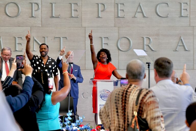Mayor Cherelle Parker urges attendees at the National Constitution Center for the presentation of her Philadelphia Freedom Awards to raise their index fingers
