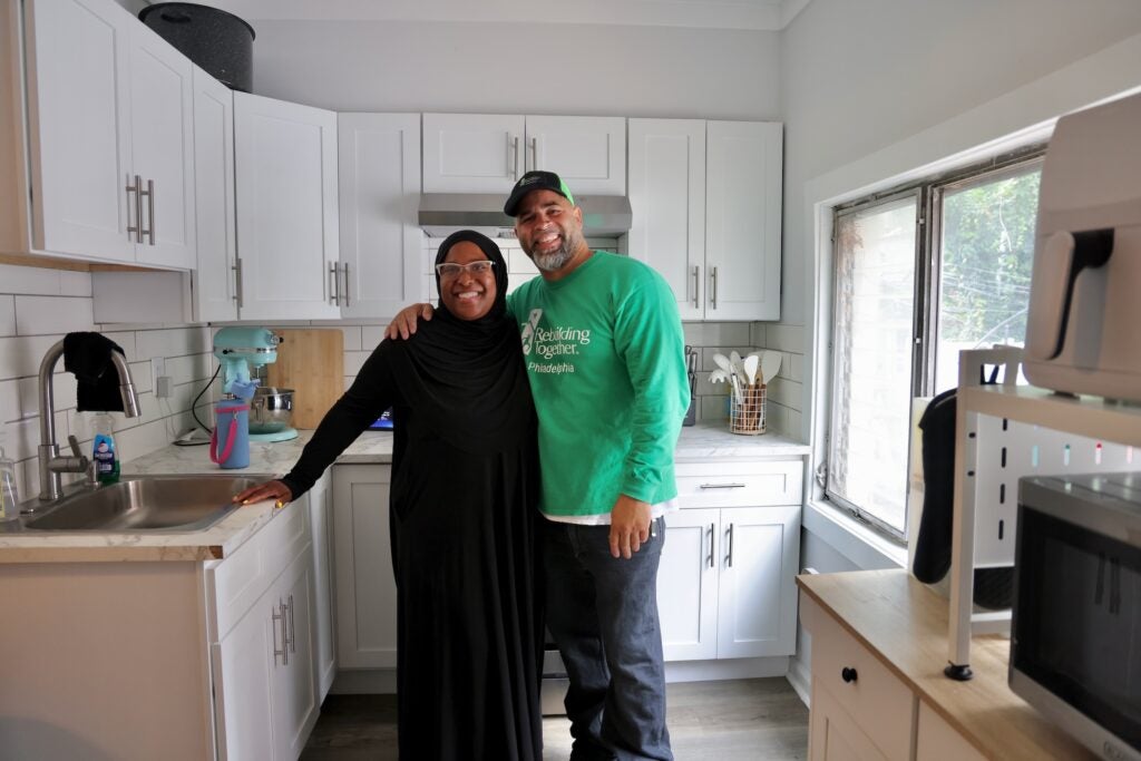 Homeowner Tanesha Oglesby and Hector Espinosa of Rebuilding Together Philadelphia