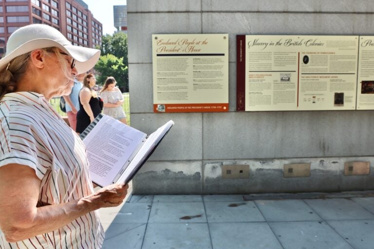 Ann Kell reading out loud at the President's House exhibit.