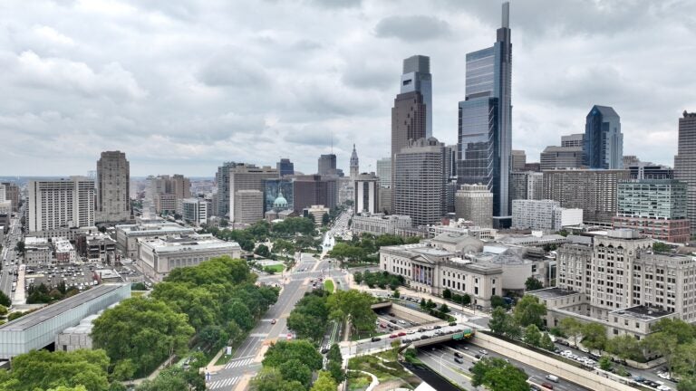 Aerial photo of the Philly skyline looking down the Parkway toward City Hall.