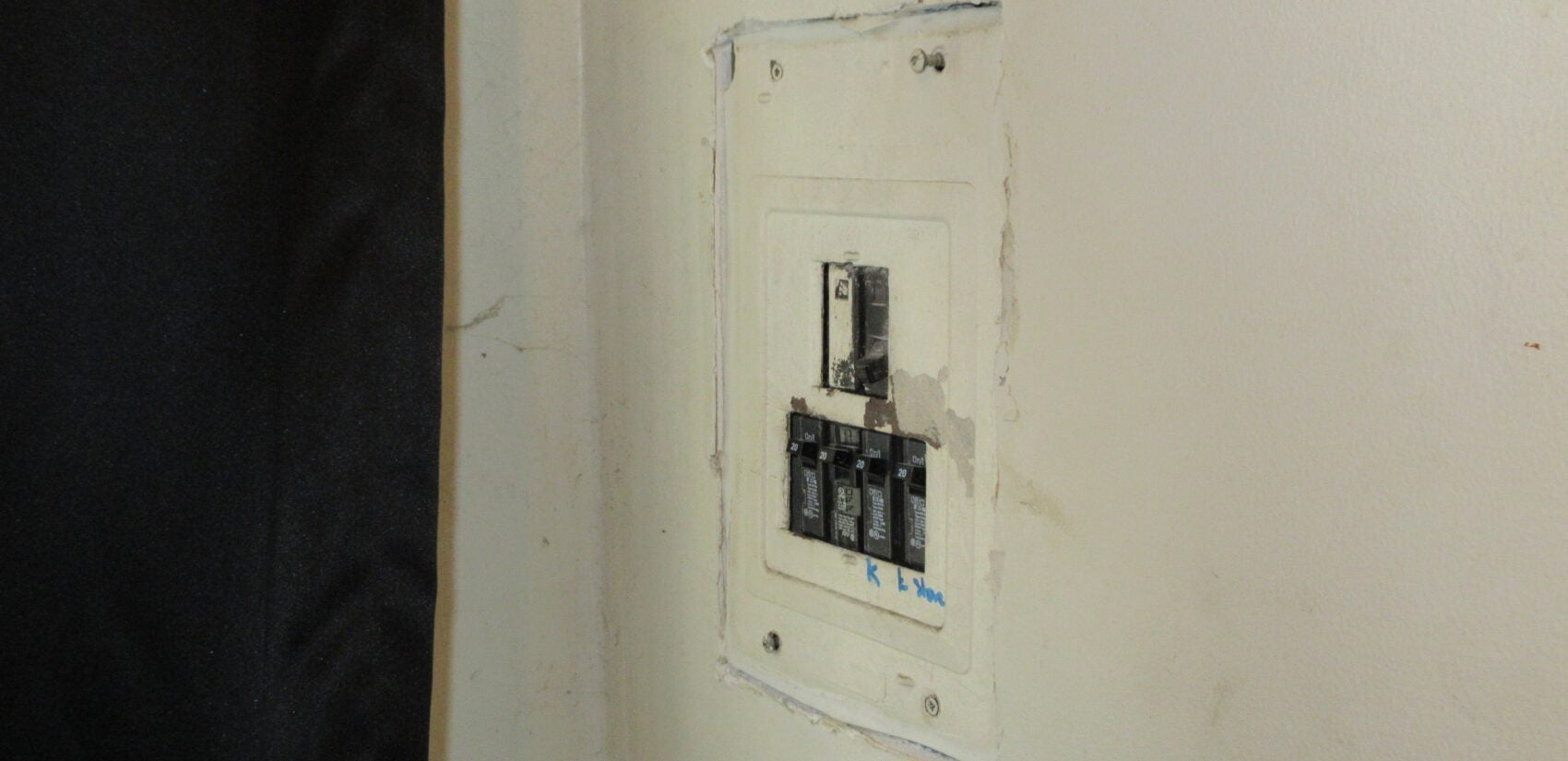 An exposed electric breaker box