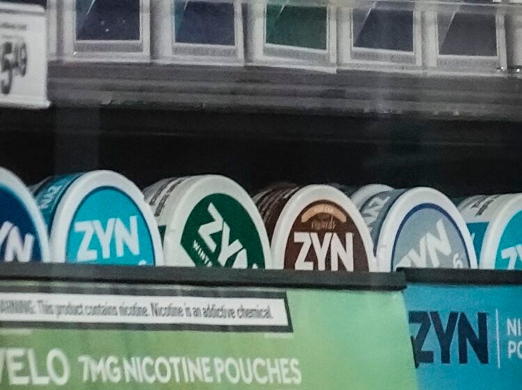 FILE - Containers of Zyn, a smokeless nicotine pouch, are displayed for sale among other nicotine and tobacco products at a newsstand on Feb. 23, 2024, in New York.  (AP Photo/Bebeto Matthews, File)