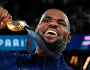 United States' LeBron James (6) celebrates after beating France to win the gold medal during a men's gold medal basketball game at Bercy Arena at the 2024 Summer Olympics, Sunday, Aug. 11, 2024, in Paris, France. (AP Photo/Rebecca Blackwell)