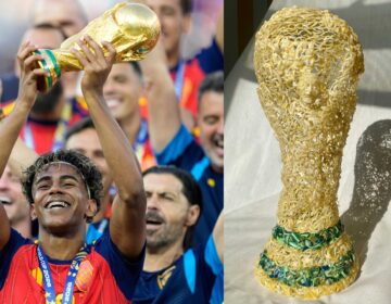 Spain's Lamine Yamal celebrates with the trophy
