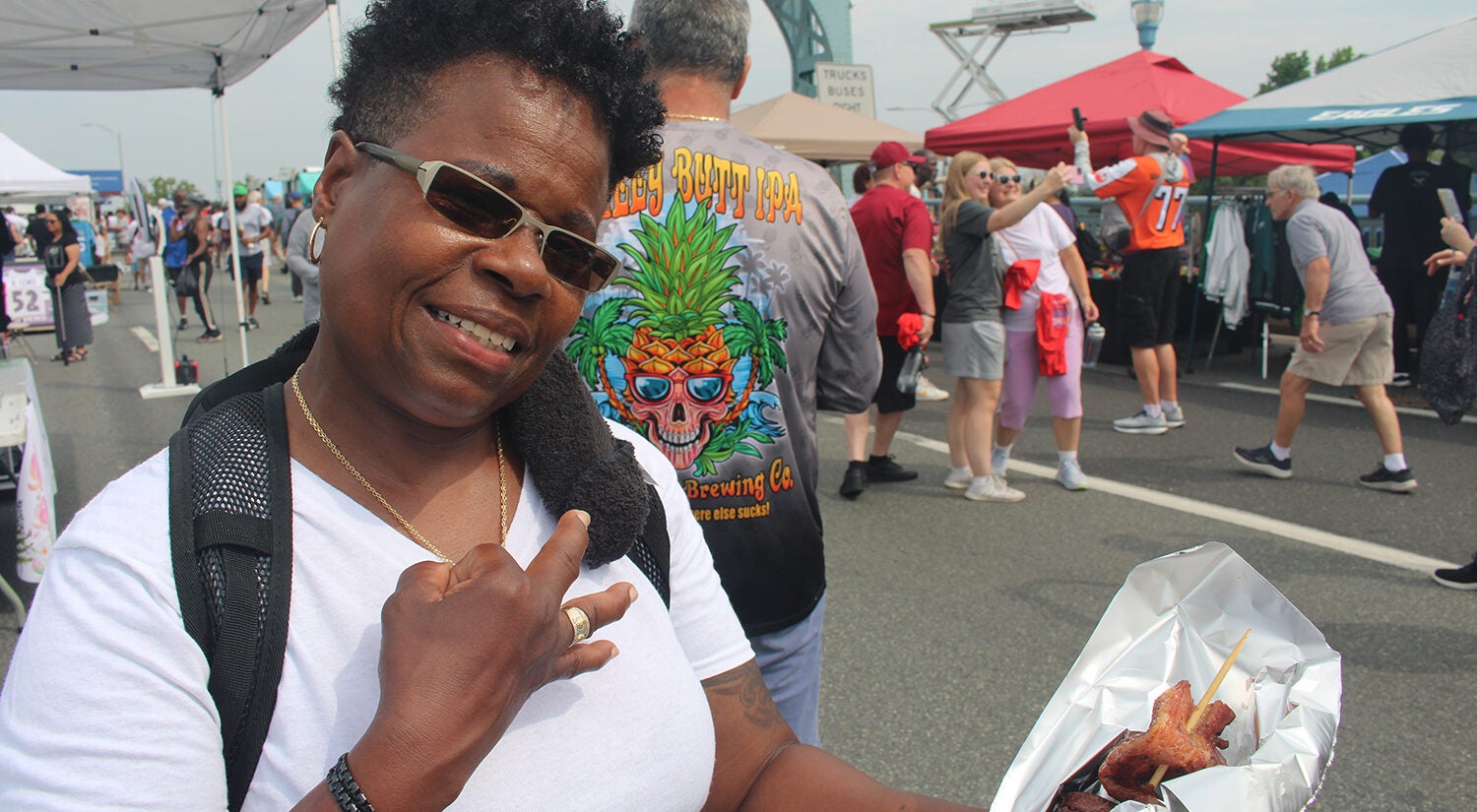 A woman poses for a photo on the Ben Franklin Bridge