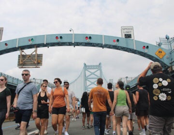ben-franklin-bridge-100-13 People walk across the Ben Franklin Bridge