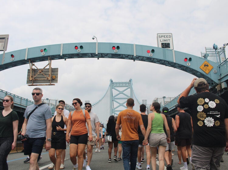 ben-franklin-bridge-100-13 People walk across the Ben Franklin Bridge