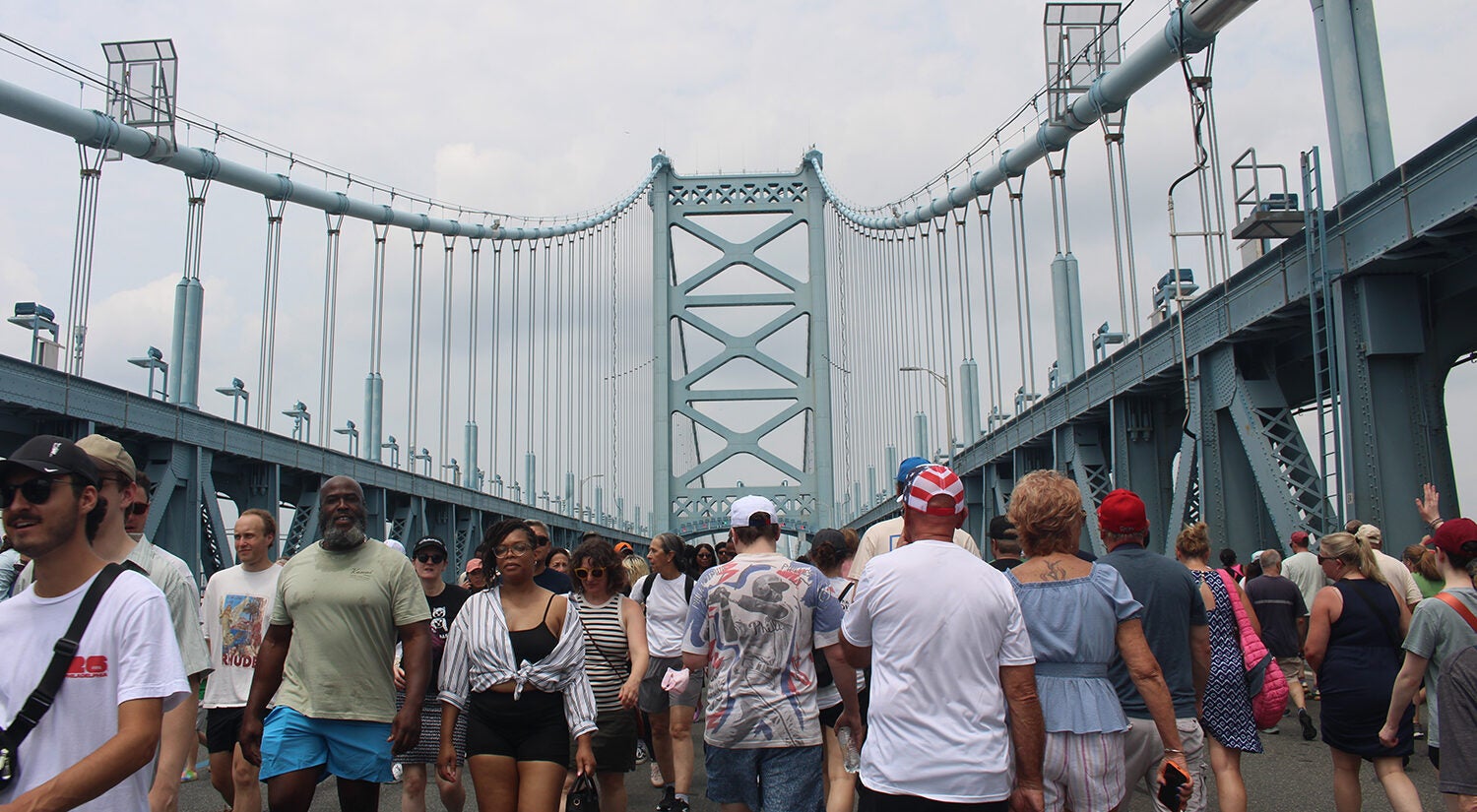 Tens of thousands of people walked across the Benjamin Franklin Bridge on Saturday, July 11, 2026, in celebration of the landmark's 100th birthday. (Emily Neil/WHYY)