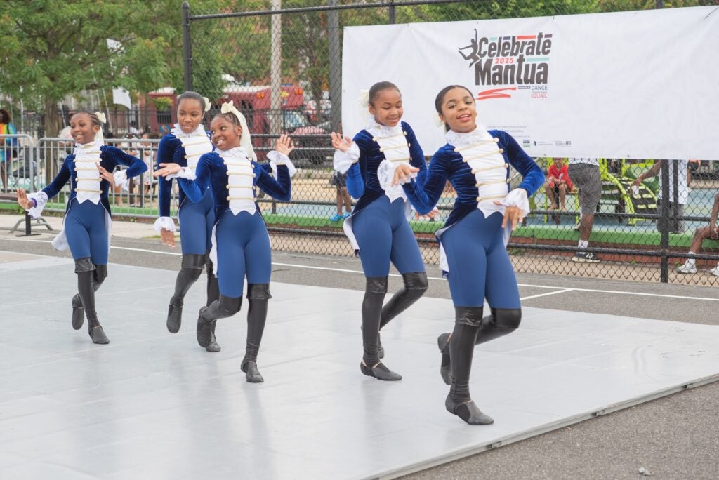 Dancers performing in matching costumes