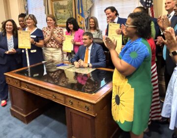 Delaware Gov. Matt Meyer and state lawmakers celebrate the signing of the fiscal year 2027 operating budget on June 30.