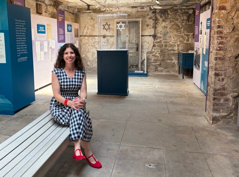 Kerry Sauter is sitting inside the exhibition space.