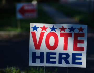 election-vote-here-sign-polling-place-AP-073026 A ''Vote Here'' sign on a lawn directs voters to a polling place for an election on June 2, 2026.