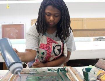 fabric-workshop-museum-high-school-program-5 A woman participates in a screen printing program