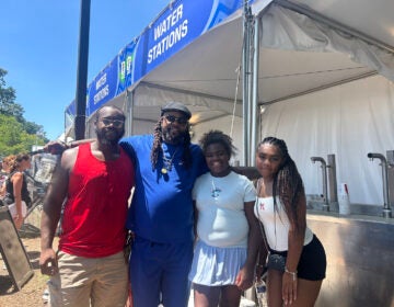 fan-fest-philadelphia-heat A family poses for a picture in from of a water station at the FIFA Fan Fest in Philadelphia