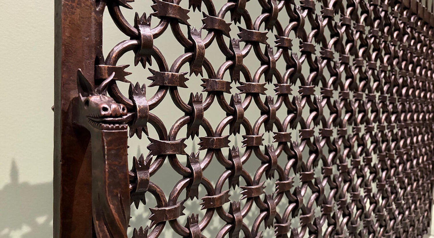 A close-up of a wrought iron fire screen