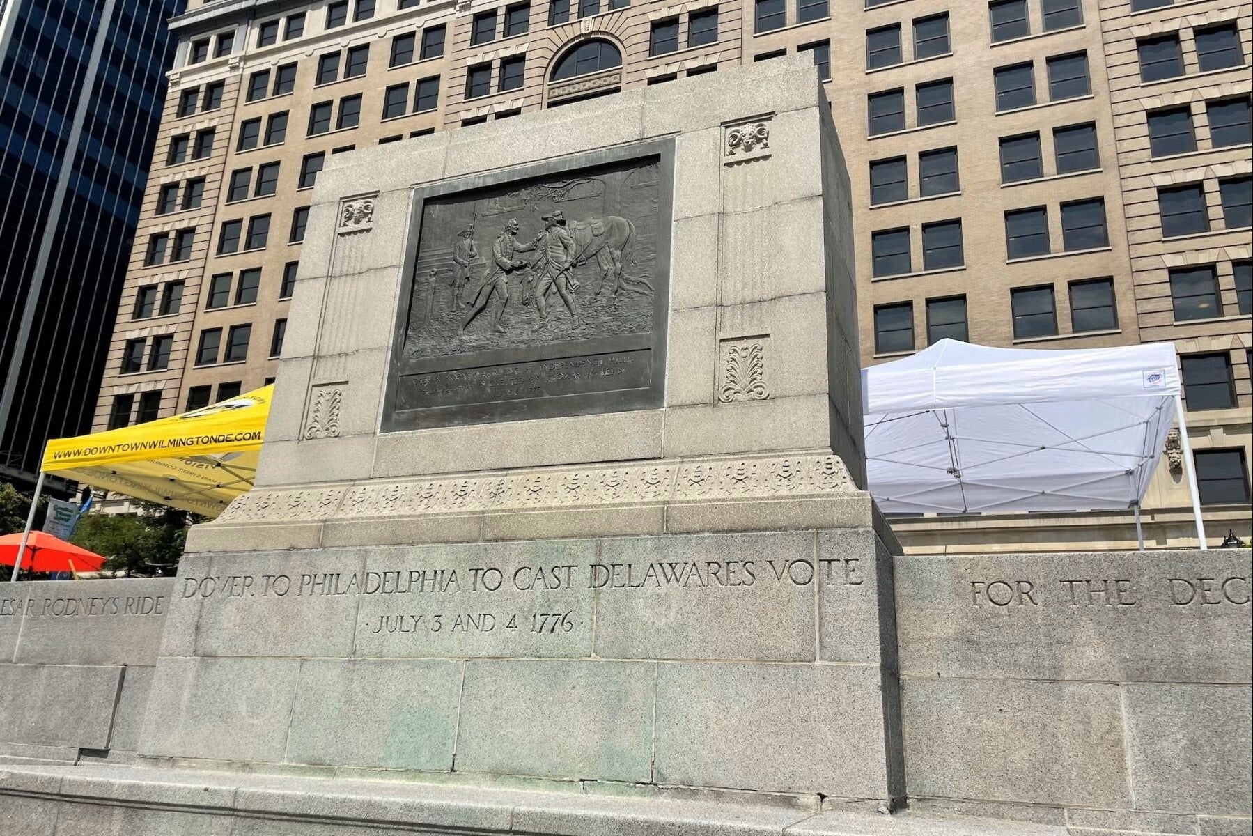 Empty pedestal in the square where the statue once stood.