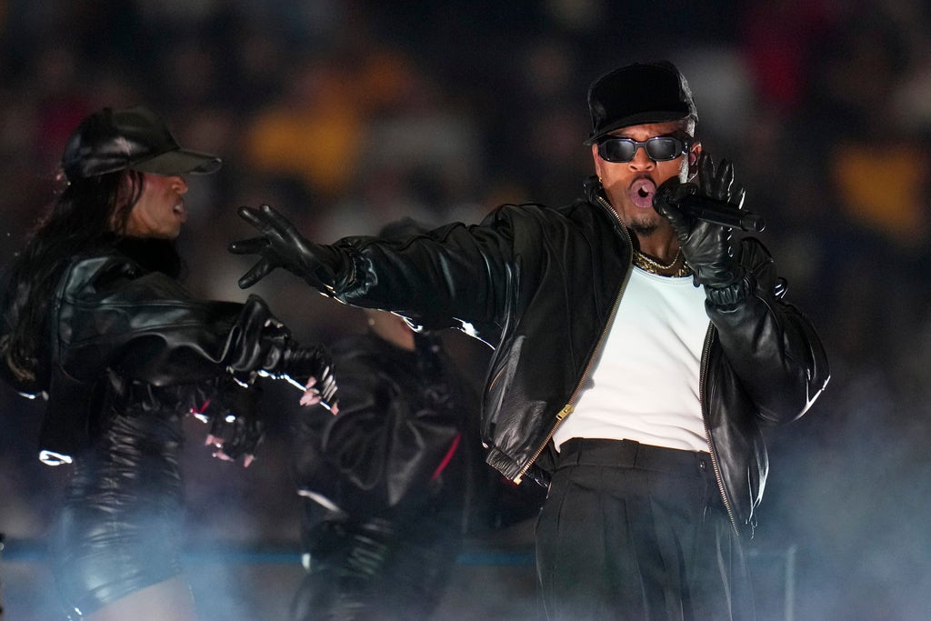 Singer Ne-Yo performs at halftime of the Big 12 Conference championship NCAA college football game