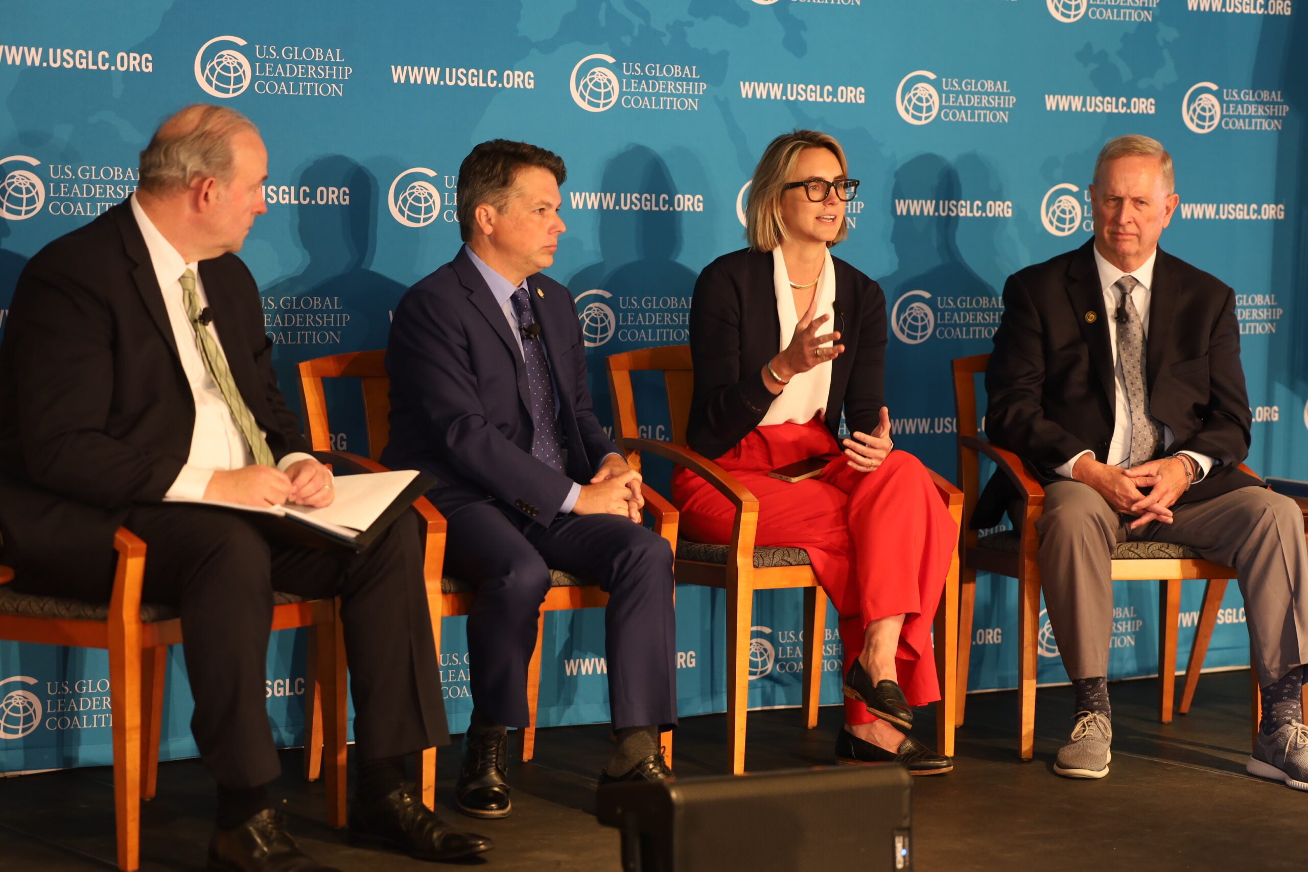 Jennifer Siler speaks while Jason Gross, Brendan Boyle and Thomas Trask listen