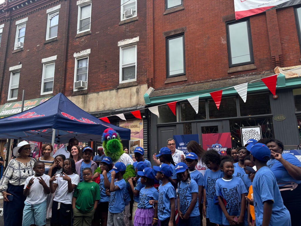 The Phillie Phanatic poses with children for a photo