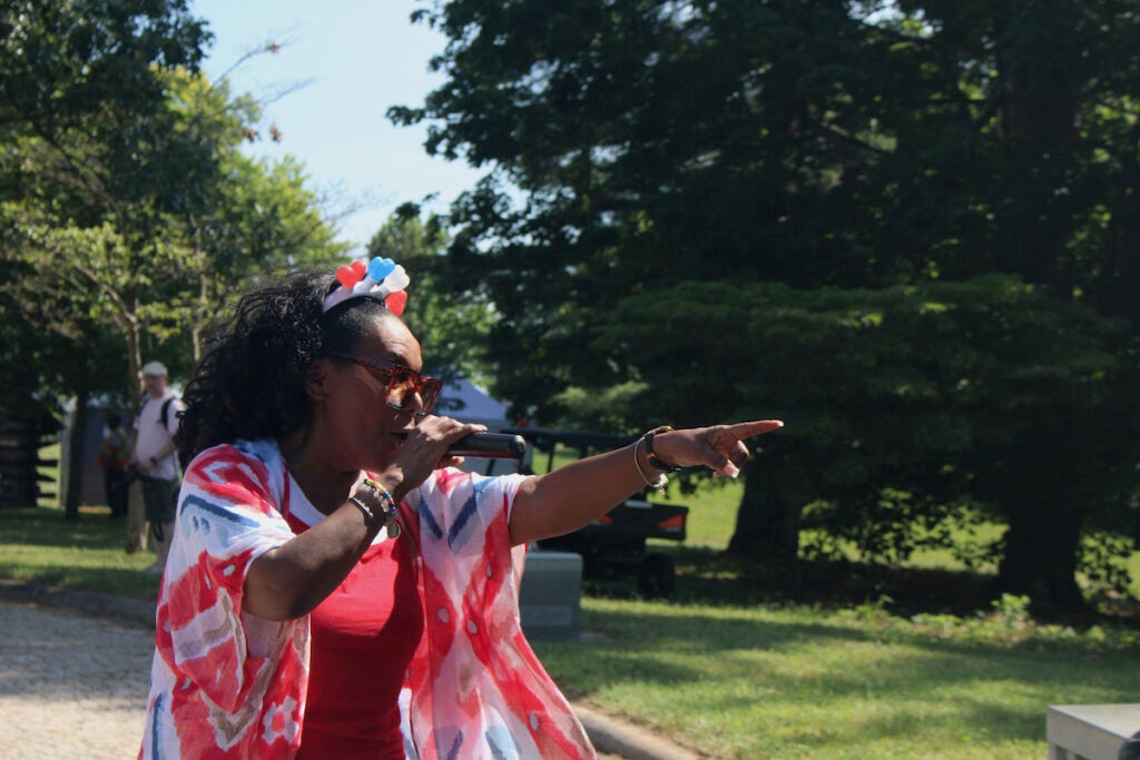 Performer pointing at crowd as band performs at Valley Forge National Historical Park