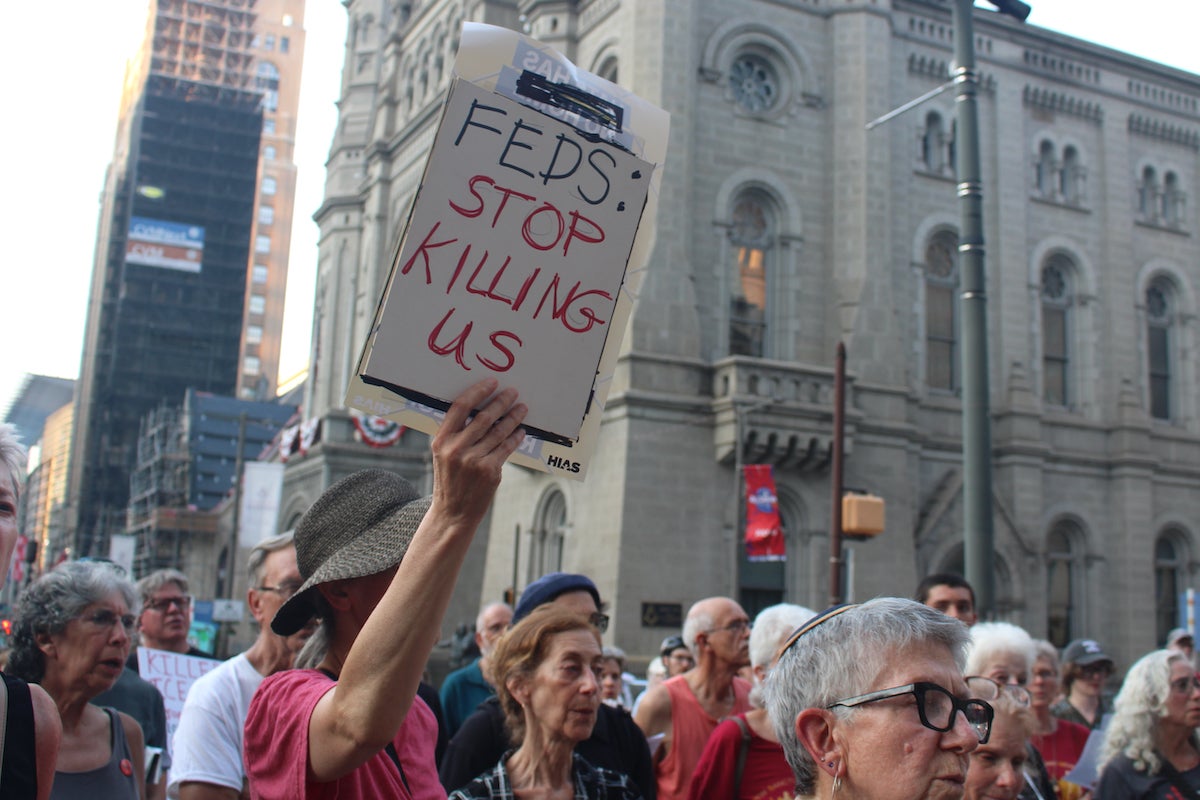 People at a vigil outside of Philadelphia City Hall.