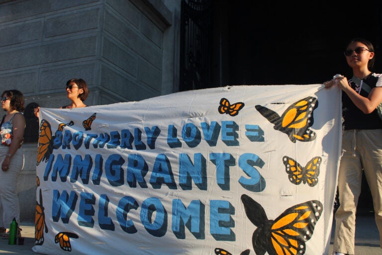 People at a vigil outside of Philadelphia City Hall.