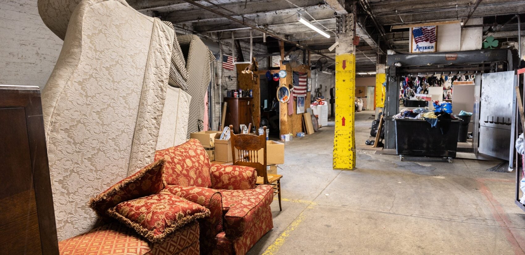 Furniture and clothing donations in a room