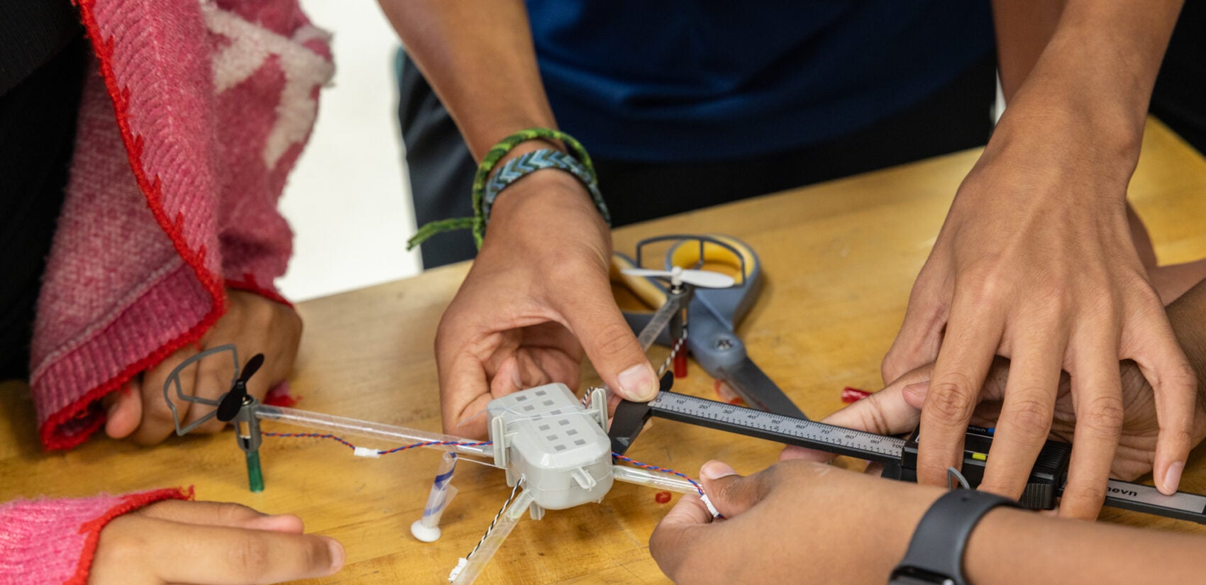 a drone being worked on by children