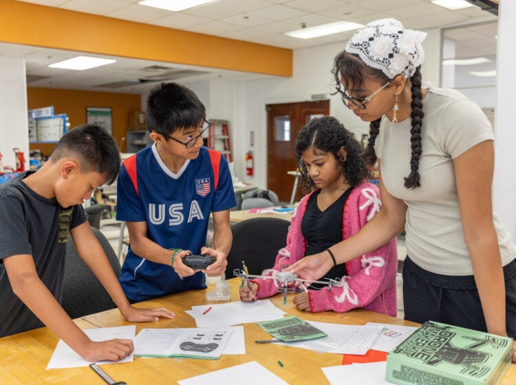 08 06 2026 k paynter STEM camp Thomas Jefferson University -4 Four children at a table building a drone