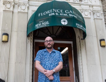 08 24 2026 k paynter florence garden resident-2 Jared Winters stands in front of Florence Gardens