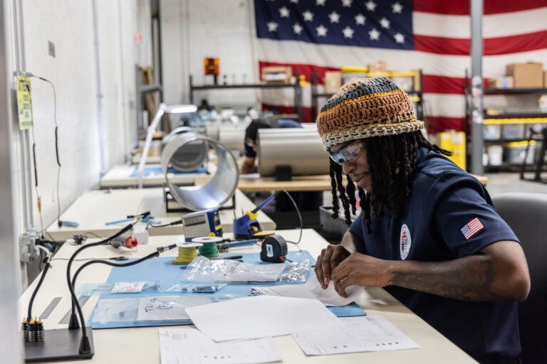 an employee at a desk at the Albacore facility