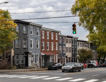 10-25-2023-k-paynter-wilmington-housing-file-10 copy Several rowhouses in Wilmington, Delaware near a traffic light