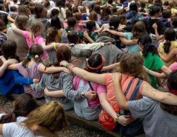 2021 07 10-r wisniewski-milford pa jewish summer camp-shabbat Campers place their arms around one another